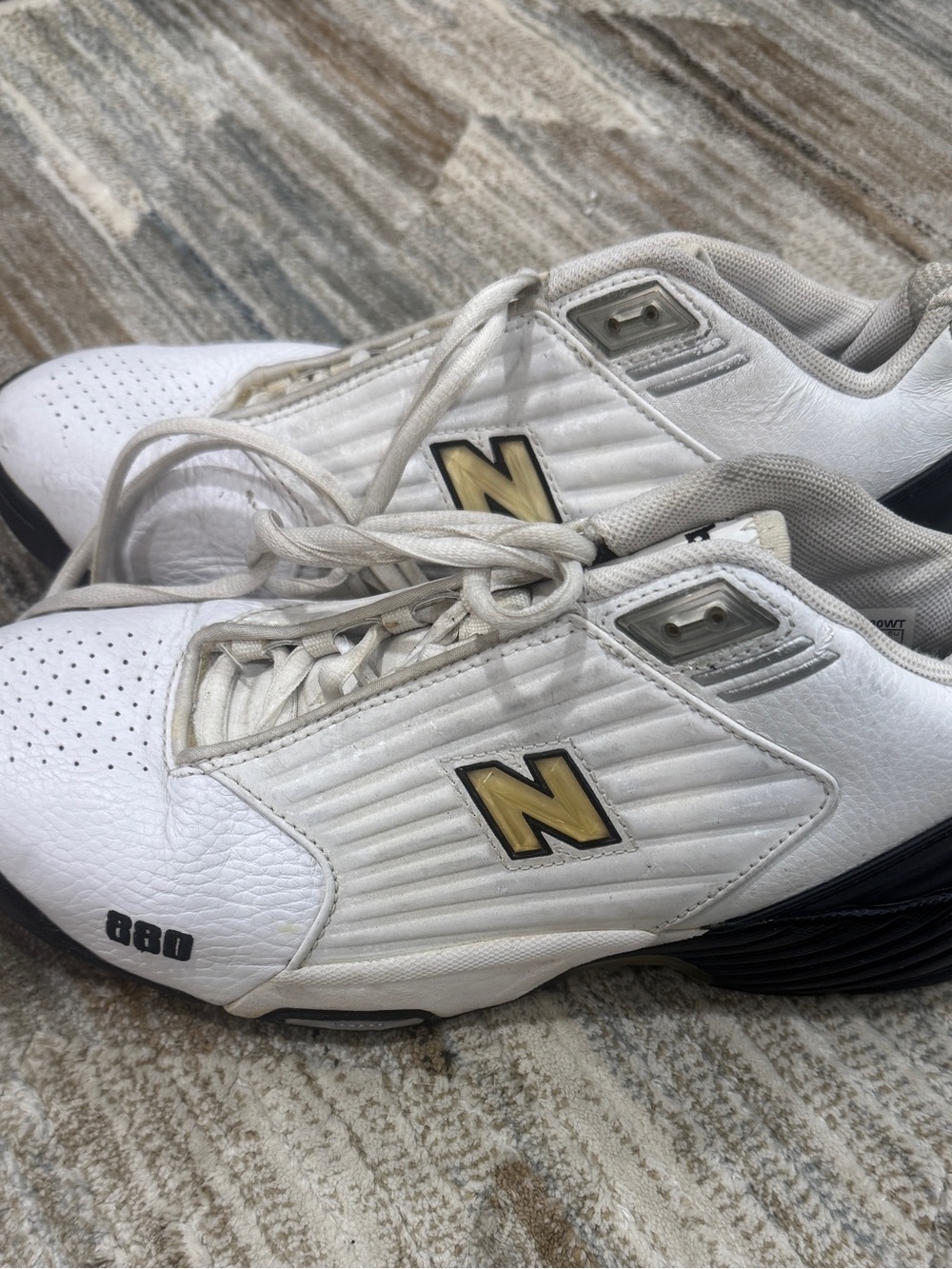 New Balance Men’s White and Black Athletic Sneakers with Gold Logo